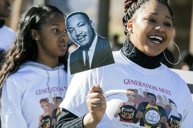 I'yanne Davis holds a sign showing the image of Martin Luther King Jr. during the MLK parade in downtown Las Vegas on Monday Jan. 16, 2017. Jeff Scheid/Las Vegas Review-Journal Follow @jeffscheid