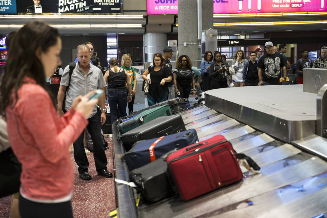 Passengers wait for their luggage at McCarran International Airport in Las Vegas on Wednesday, Aug. 9, 2017. Erik Verduzco Las Vegas Review-Journal @Erik_Verduzco