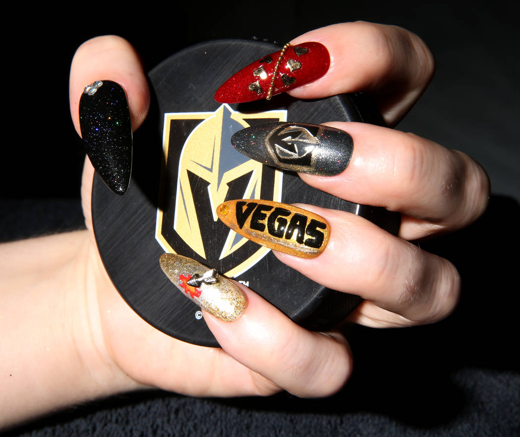 Andrea Lipomi, propietaria de Feetish Spa Parlor, muestra sus uñas con el tema Vegas Golden Knights en su salón del centro el martes 29 de mayo de 2018. K.M. Cannon Las Vegas Review-Journal @KMC ...