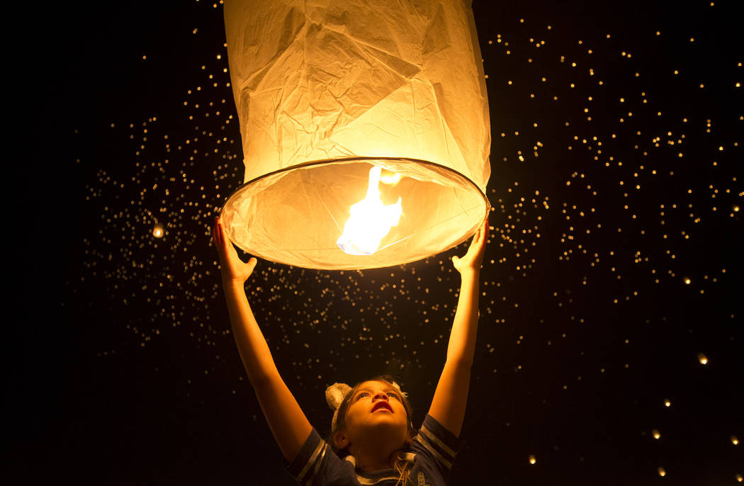 Mkilawish Arres, 9, of California prepares to release a lantern during the RiSE Lantern Festival held at the Moapa River Indian Reservation on Friday, Oct. 6, 2017. Richard Brian Las Vegas Review- ...