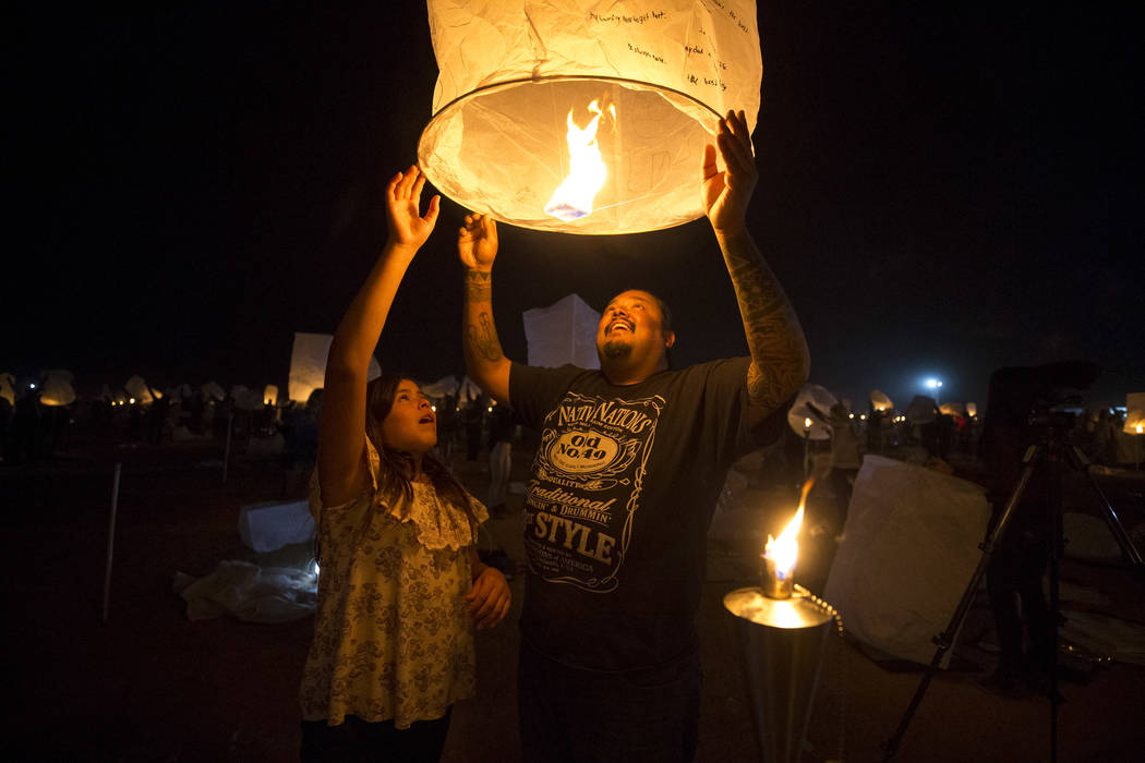 Harold Arres and his daughter Hattie release a lantern during the RiSE Lantern Festival held at the Moapa River Indian Reservation on Friday, Oct. 6, 2017. Richard Brian Las Vegas Review-Journal @ ...