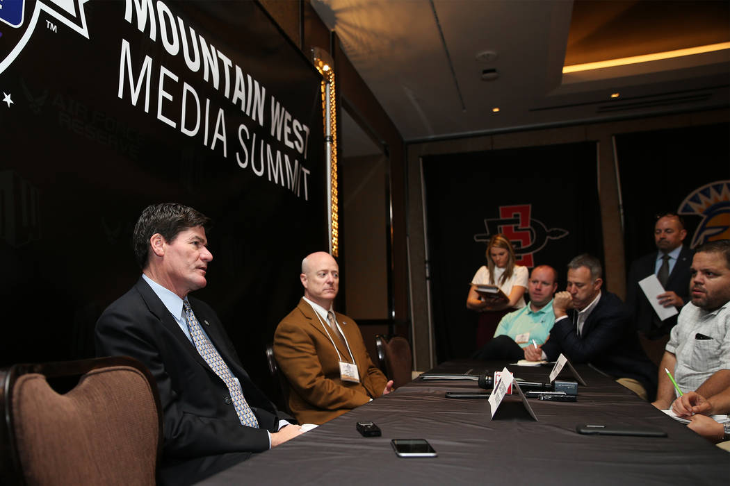 Commissioner Craig Thompson, left, with Senior Associate Commissioner Dan Butterfly, speaks during the Mountain West Conference Media Summit at The Cosmopolitan of Las Vegas, Tuesday, Oct. 16, 201 ...