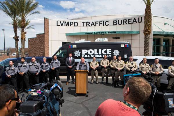 Nevada Highway Patrol Capt. Charles Haycox, center, speaks during an event marking 500 arrests ...