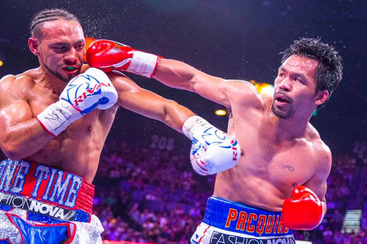 Manny Pacquiao golpea a Manny Pacquiao durante la Ronda 1 de su pelea por el campeonato mundial ...