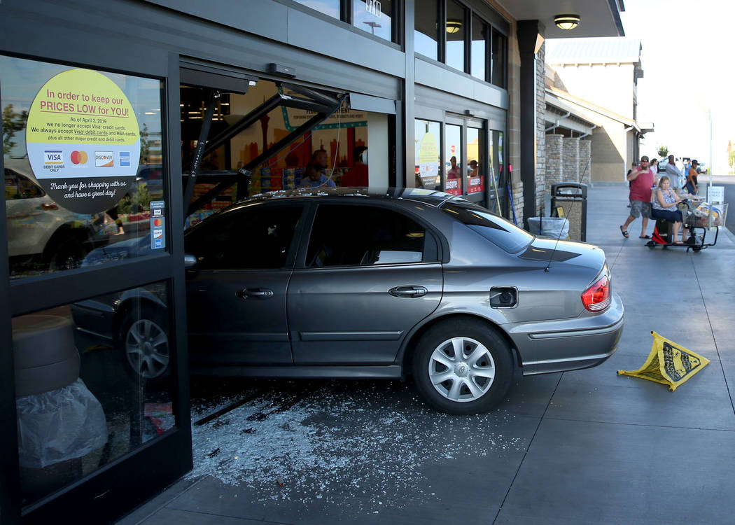 A car crashes through the main entrance of the Smith's Marketplace in Skye Canyon in Las Vegas, ...