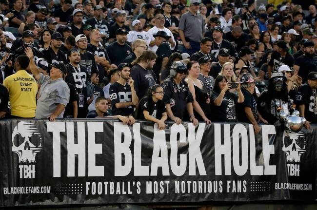 Los fans de los Raiders que componen The Black Hole disfrutan de su papel antagónico, llamánd ...