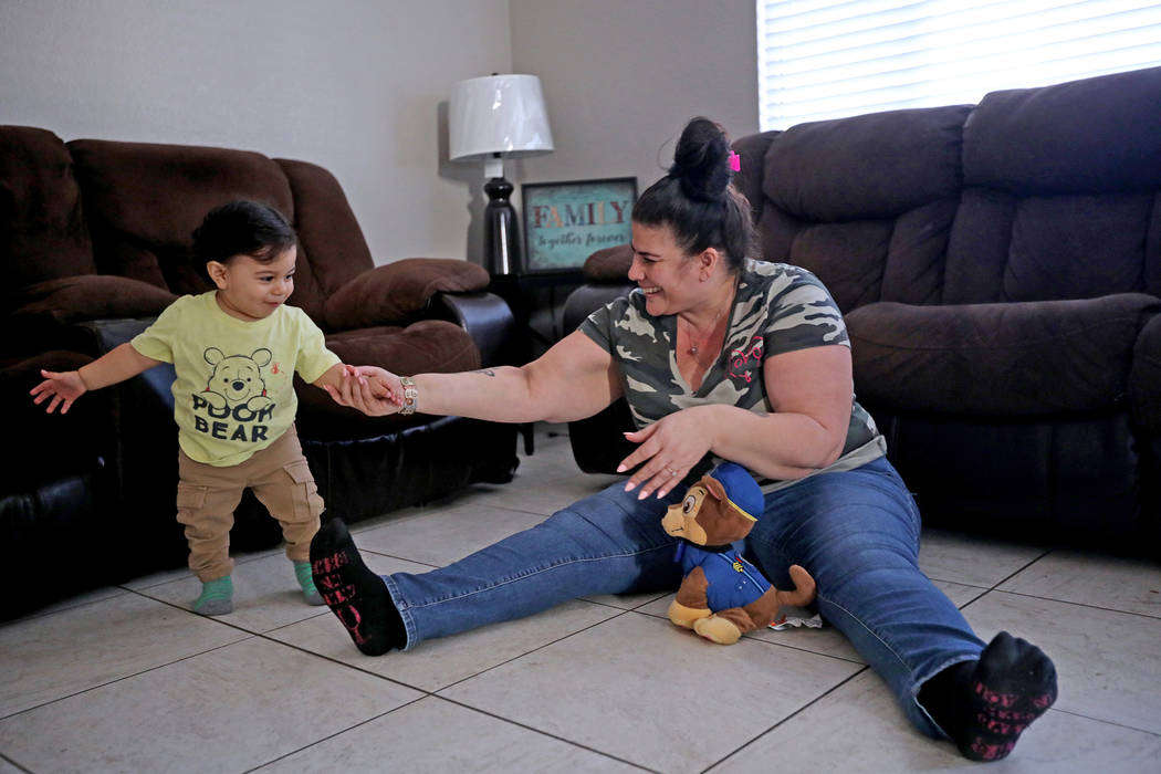 Hanna Olivas juega con su nieto Damián Córdova, de un año, en su casa de Las Vegas el miérc ...