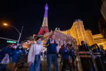 Tourists walk down Las Vegas Blvd., on the Strip, Friday, Nov. 27, 2020, in Las Vegas. (Elizabe ...