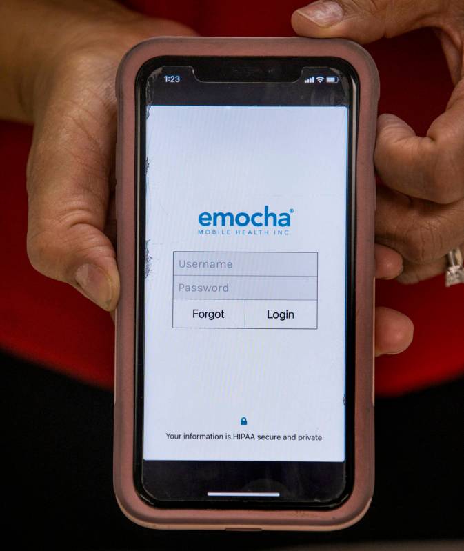Clark County Education Association President Marie Neisess with the emocha app on her phone whi ...