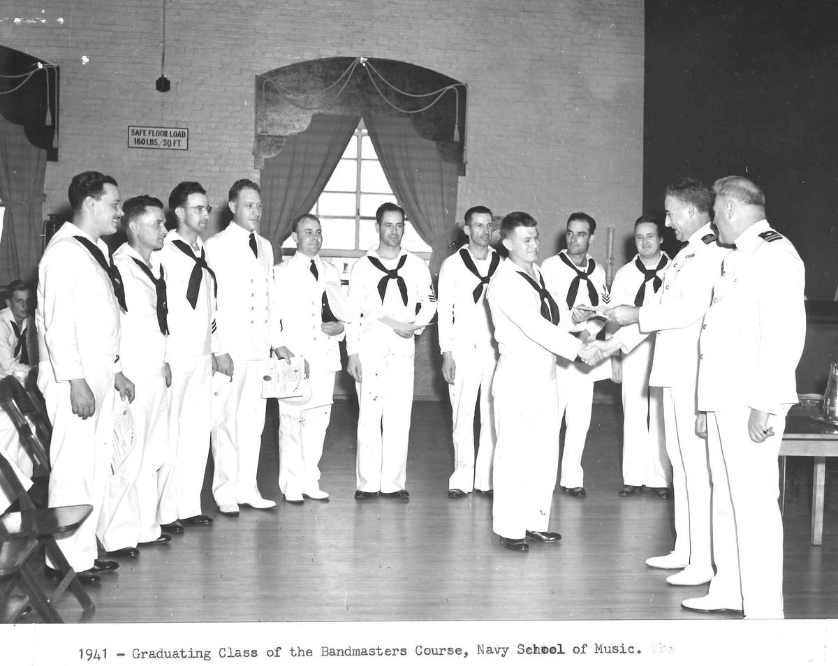 A graduation ceremony at the U.S. Navy School of Music shows U.S.S. Arizona bandmaster Frederic ...