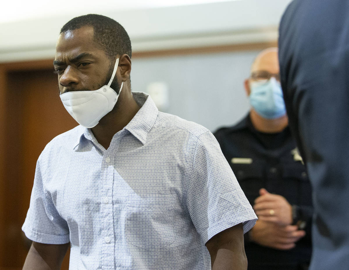 Corey Evans, a former resident of the Alpine Motel Apartments, leaves the courtroom during a pr ...