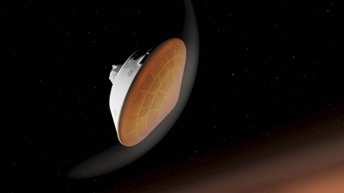 En esta ilustración facilitada por la NASA, el aeroshell que contiene a Perseverance se guía ...