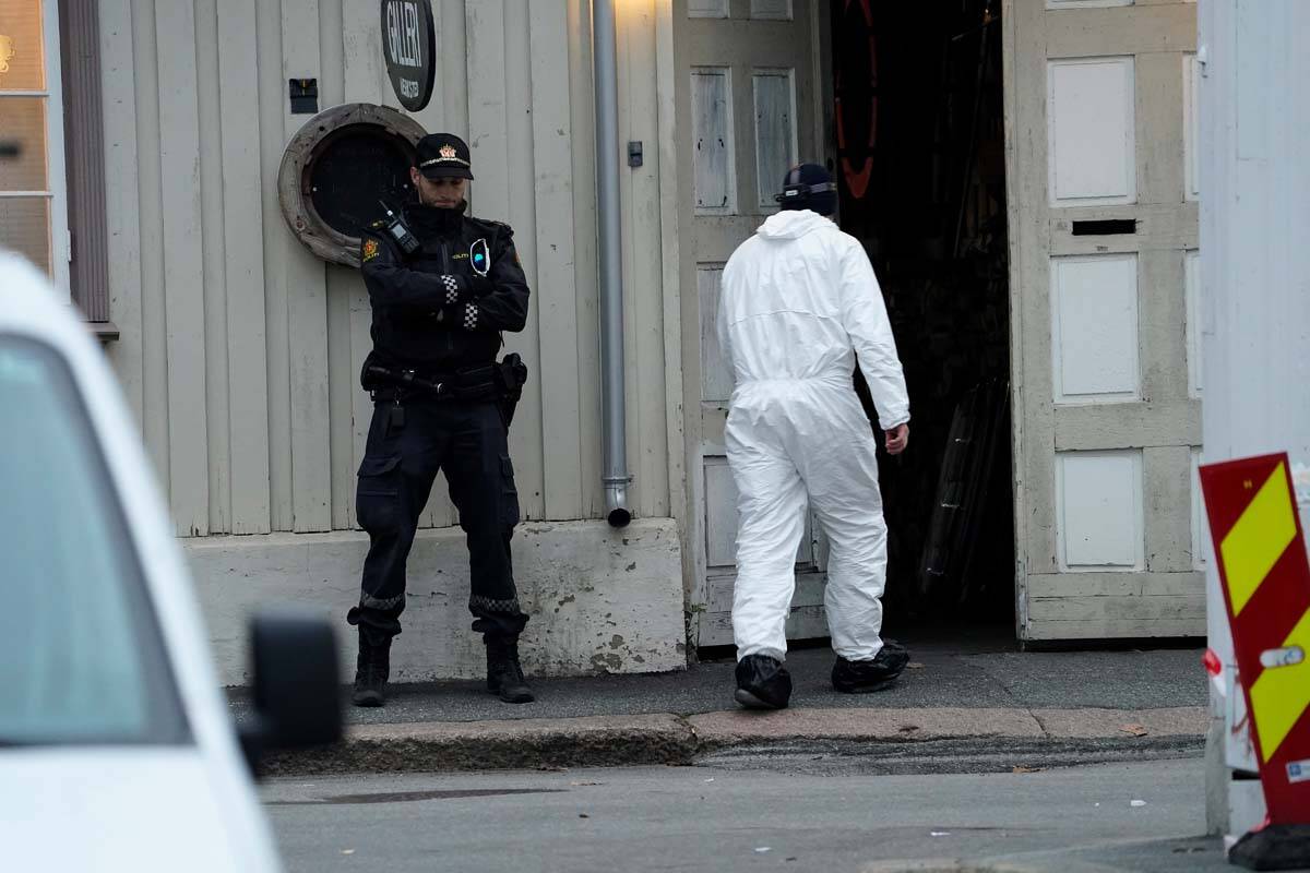 Police work near a site after a man killed several people, in Kongsberg, Norway, Thursday, Oct. ...