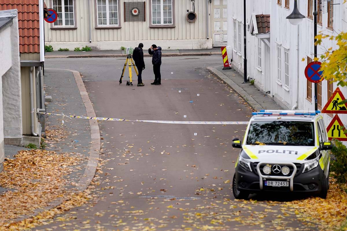 Police work near a site after a man killed several people, in Kongsberg, Norway, Thursday, Oct. ...