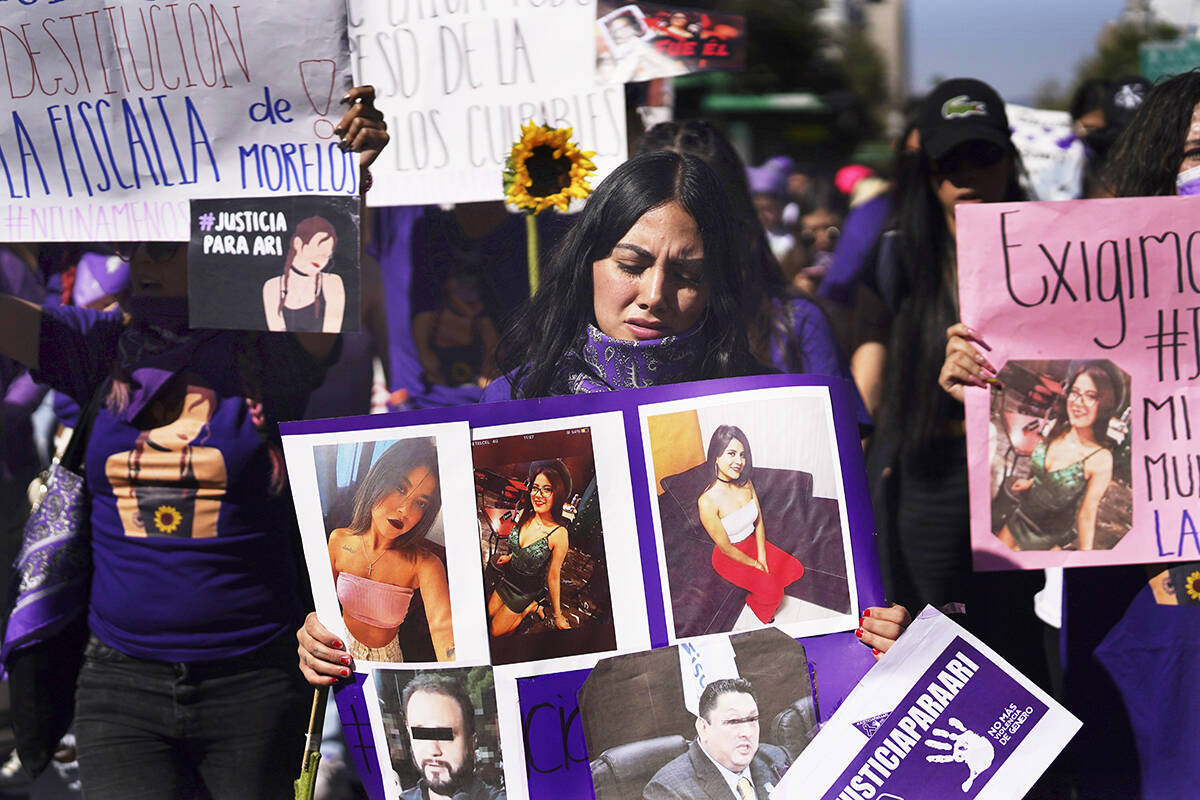 Feminist groups march to protest the murder of Ariadna Lopez, in Mexico City, Monday, Nov. 7, 2 ...