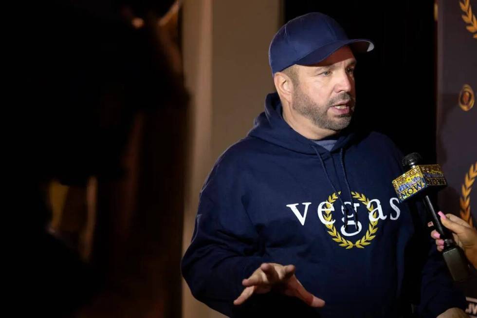 Garth Brooks speaks during a press conference before his residence 