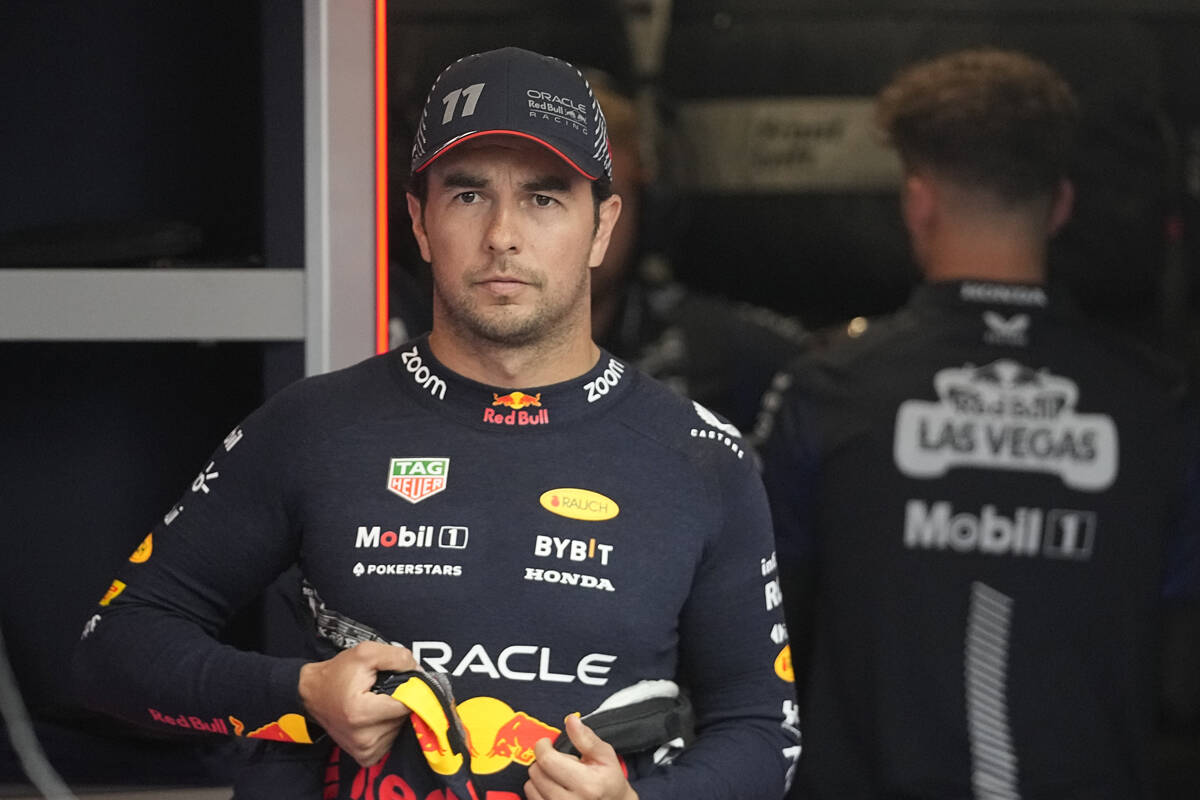 El piloto mexicano de Red Bull Sergio Pérez, espera en el garaje antes de la primera sesión d ...