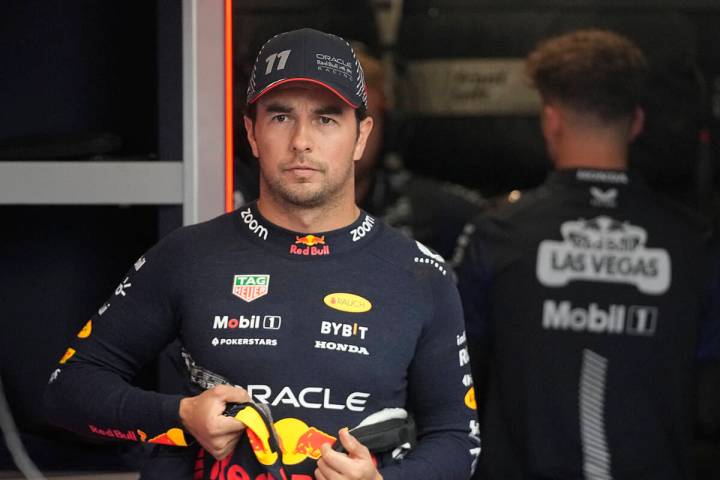 El piloto mexicano de Red Bull Sergio Pérez, espera en el garaje antes de la primera sesión d ...