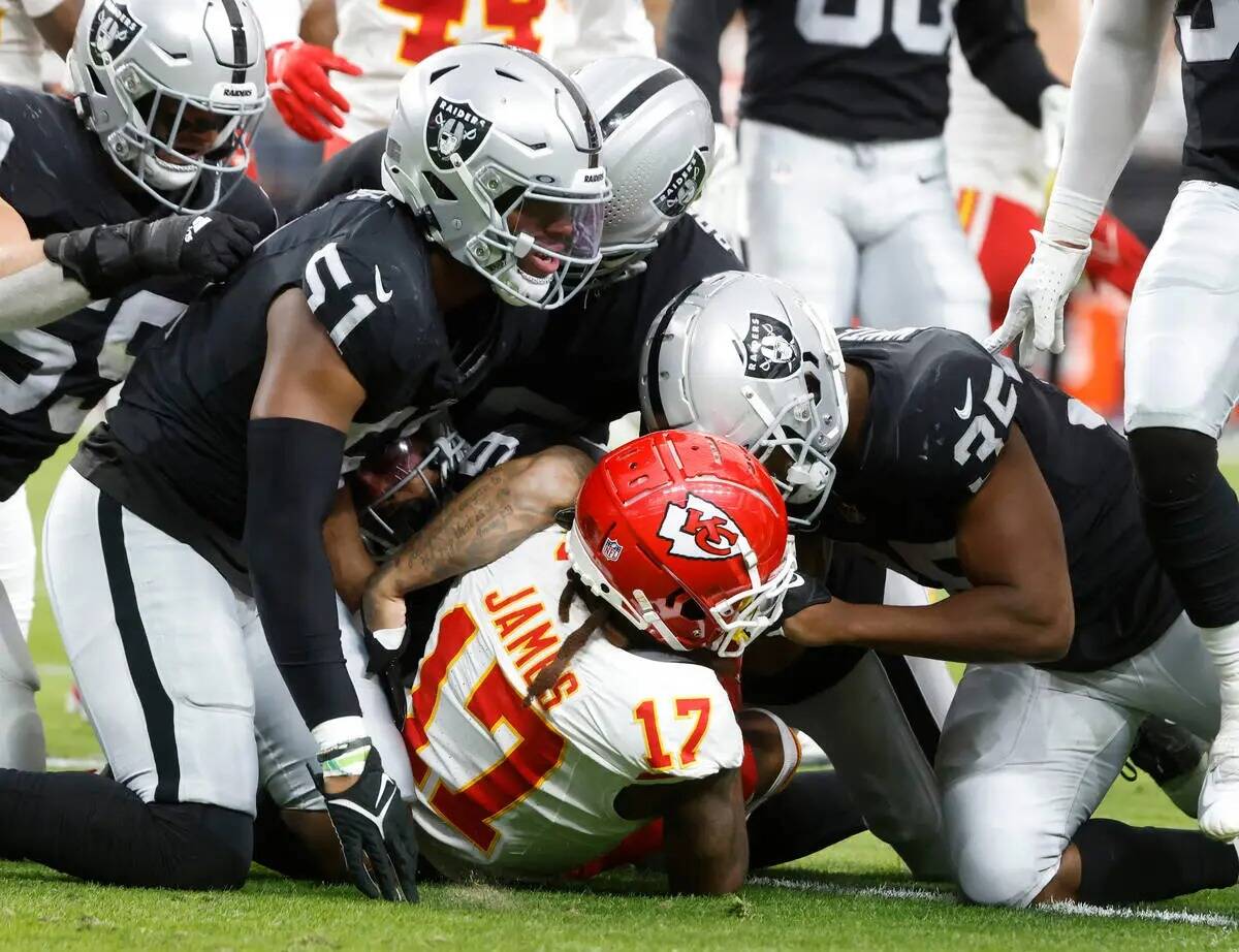 Kansas City Chiefs wide receiver Richie James (17) is down by Raiders defense during the second ...
