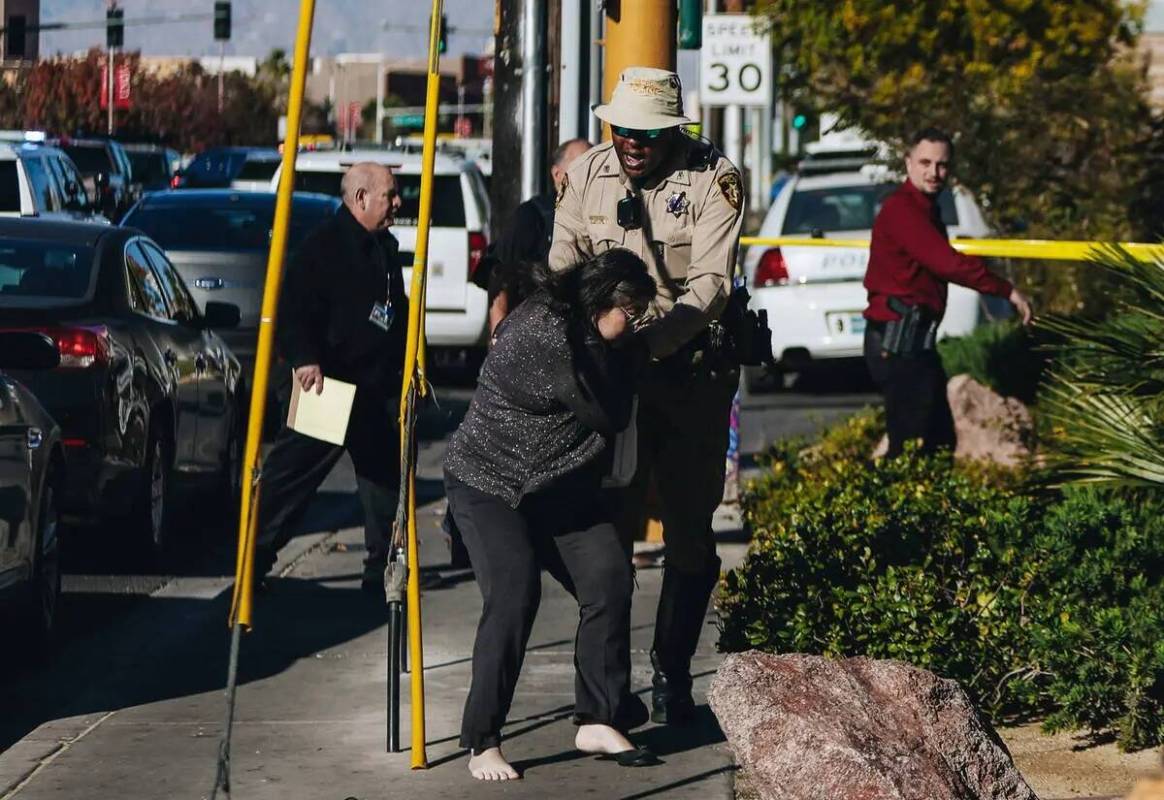 Police are seen at the scene of a shooting on the UNLV campus on Wednesday, Dec. 6, 2023, in La ...