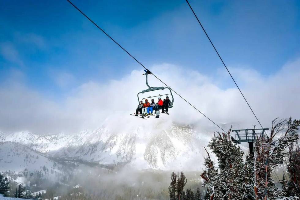 Skiers and snowboarders ride the Northwest Express Ski Lift at Mount Rose.  (Maria Colson/E...