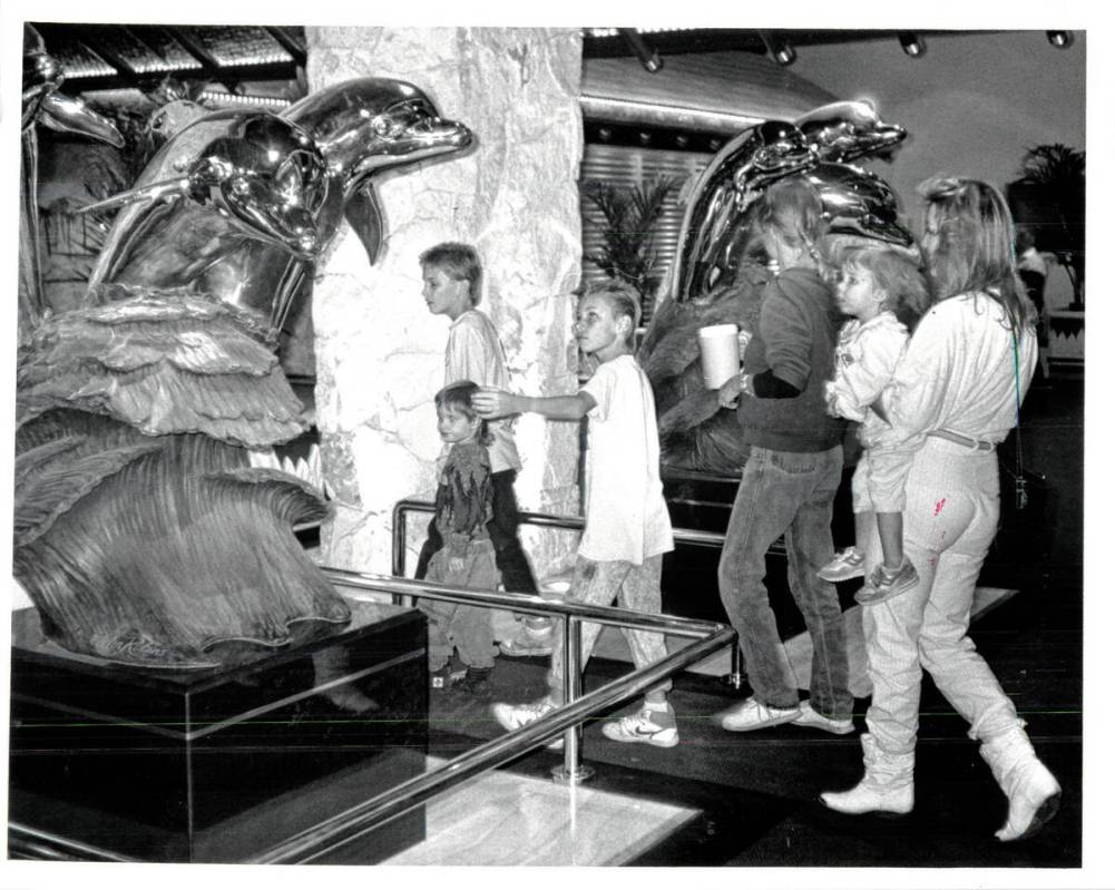 Las Vegas Review-Journal NOV 22, 1989 Sculpted dolphins greet visitors at main entrance of Mir ...